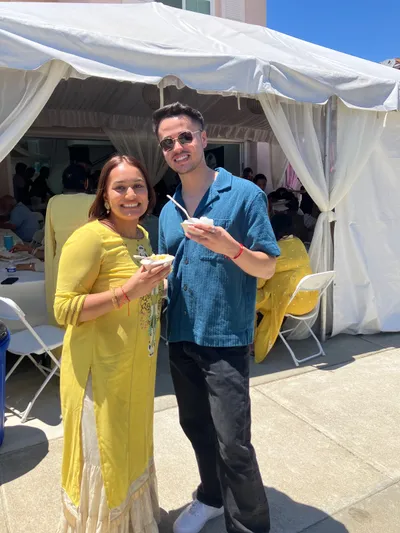 Smiling guests enjoying Tropics shave ice at a celebration