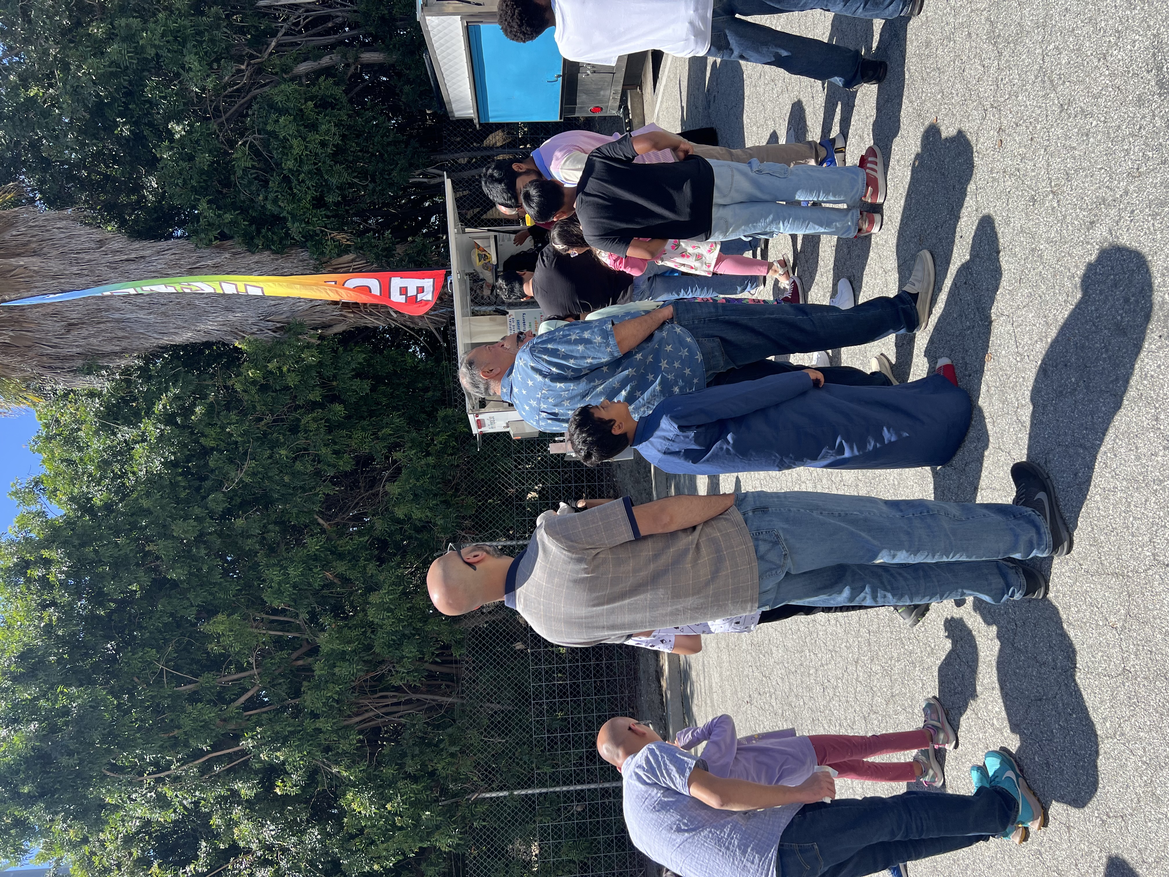 People lining up for Tropics Shave Ice at a school event